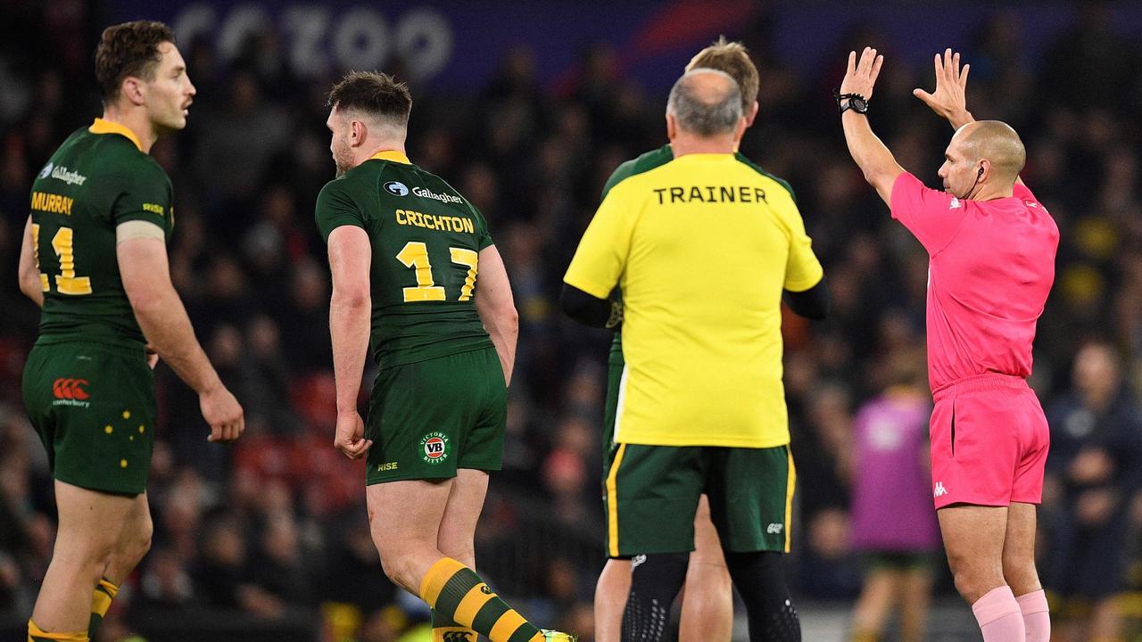 Australia's Angus Crichton (2L) is sent to the sin bin for 10 minutes during the Rugby League World Cup Men's final between Australia and Samoa at Old Trafford stadium, in Manchester, on November 19, 2022. (Photo by Oli SCARFF / AFP)