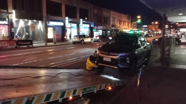 A car is towed mid-lockdown on Whitehorse Rd.