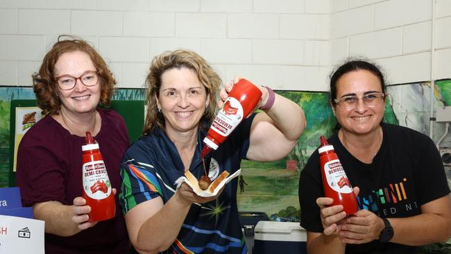 Hannah Klee, Liza Parr and Carla Eisemberg at Nakara Primary School showing off the Democracy Sauce donated by Masterfoods. Picture: Pema Tamang Pakhrin