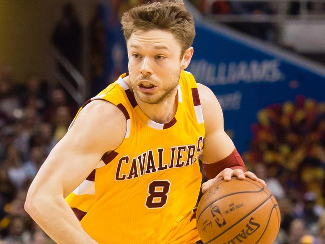 CLEVELAND, OH - JANUARY 30: Matthew Dellavedova #8 of the Cleveland Cavaliers drives past Patty Mills #8 of the San Antonio Spurs during the first half at Quicken Loans Arena on January 30, 2016 in Cleveland, Ohio. NOTE TO USER: User expressly acknowledges and agrees that, by downloading and/or using this photograph, user is consenting to the terms and conditions of the Getty Images License Agreement. Mandatory copyright notice. (Photo by Jason Miller/Getty Images)