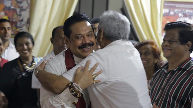 Mahinda Rajapakse, left, embraces his brother Gotabhaya. Picture: AP