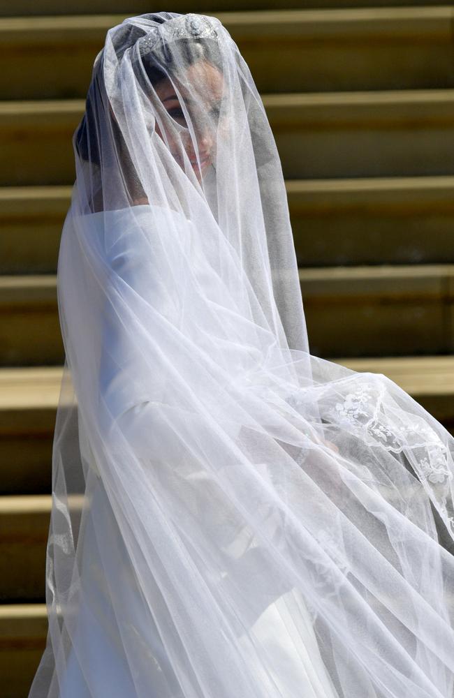 The bride turns to face the adoring crowds. Picture: Ben Birchall/Getty Images