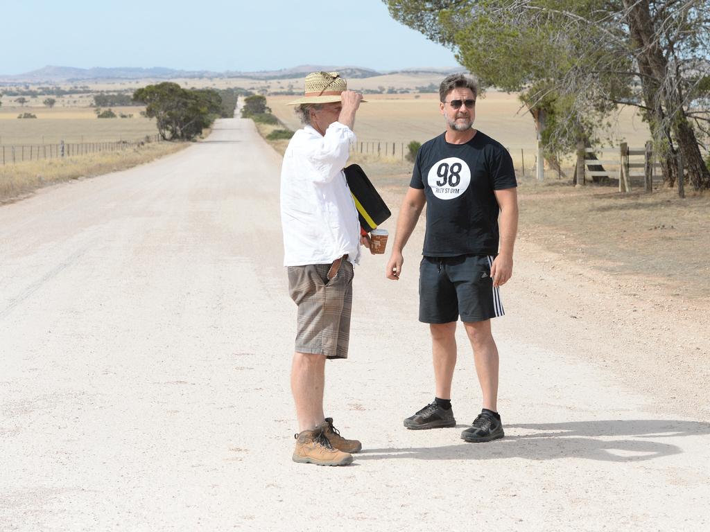 Russell Crowe plans a scene he rides a horse into the distance on a dirt road on Australia Plains. Crowe’s first film The Water Diviner, is a story of father who searches for his three sons after they fought in Gallipoli. Picture: Mark Brake