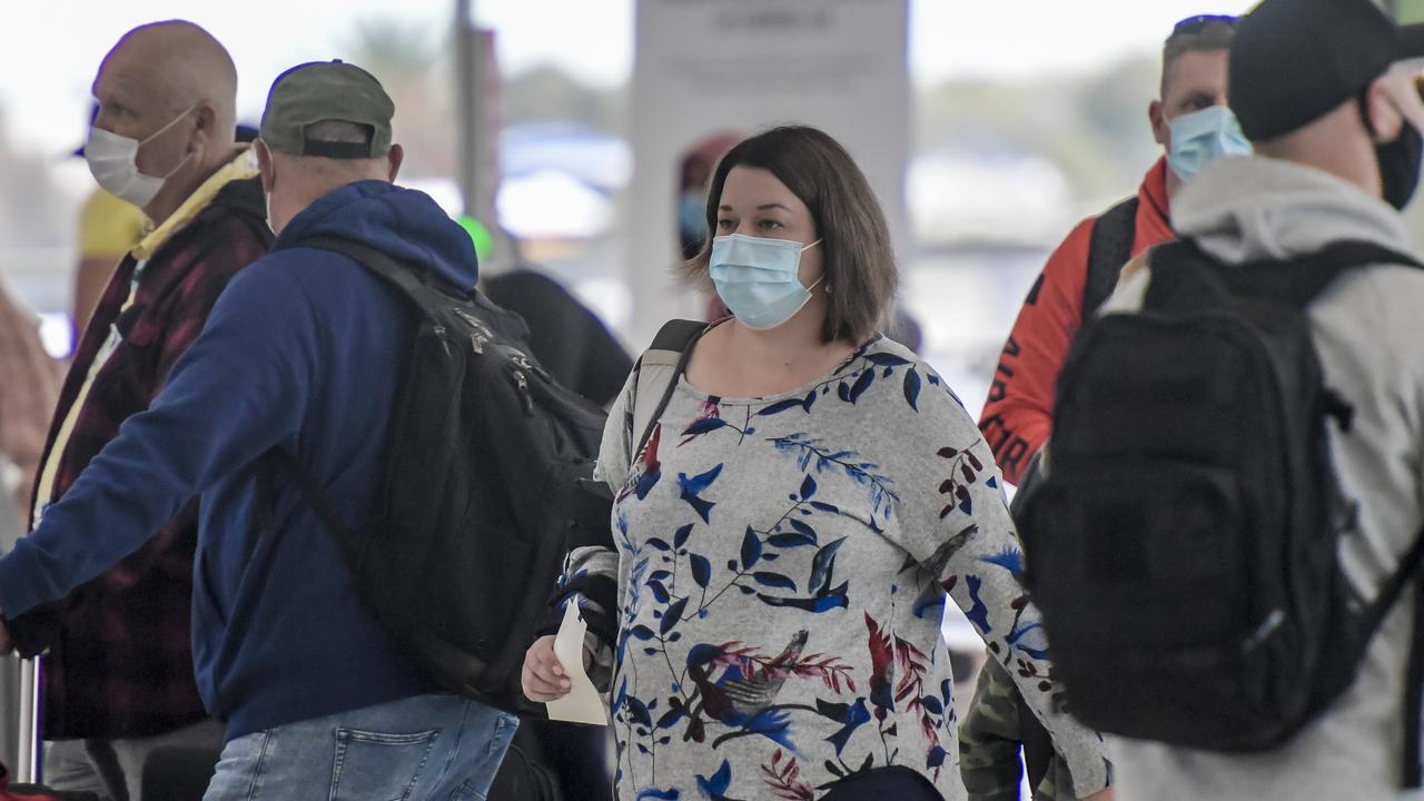 Passenger at Adelaide airport wearing masks. Picture: NCA NewsWire / Roy VanDerVegt