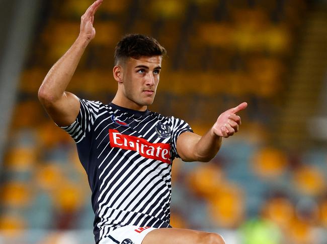 BRISBANE, AUSTRALIA - APRIL 17: Nick Daicos of the Magpies warms up prior to the 2025 AFL Round 06 match between the Brisbane Lions and the Collingwood Magpies at The Gabba on April 17, 2025 in Brisbane, Australia. (Photo by Russell Freeman/AFL Photos via Getty Images)