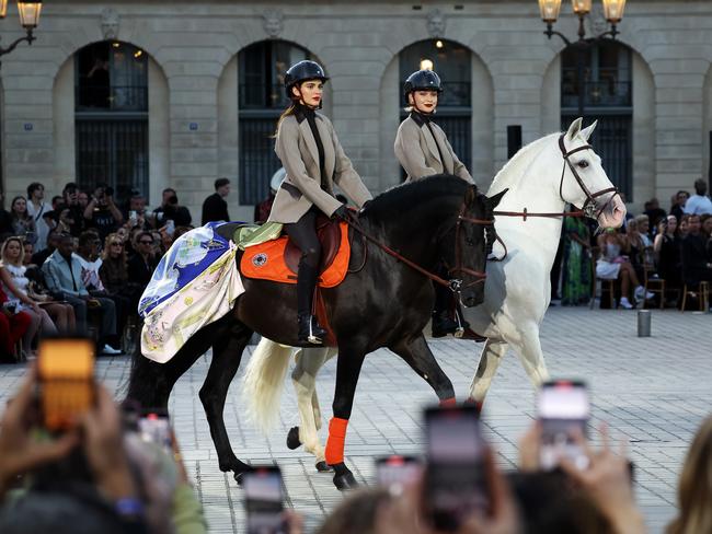 Kendall Jenner and Gigi Hadid ride horses on the runway during Vogue World: Paris at Place Vendome. Picture: Getty Images