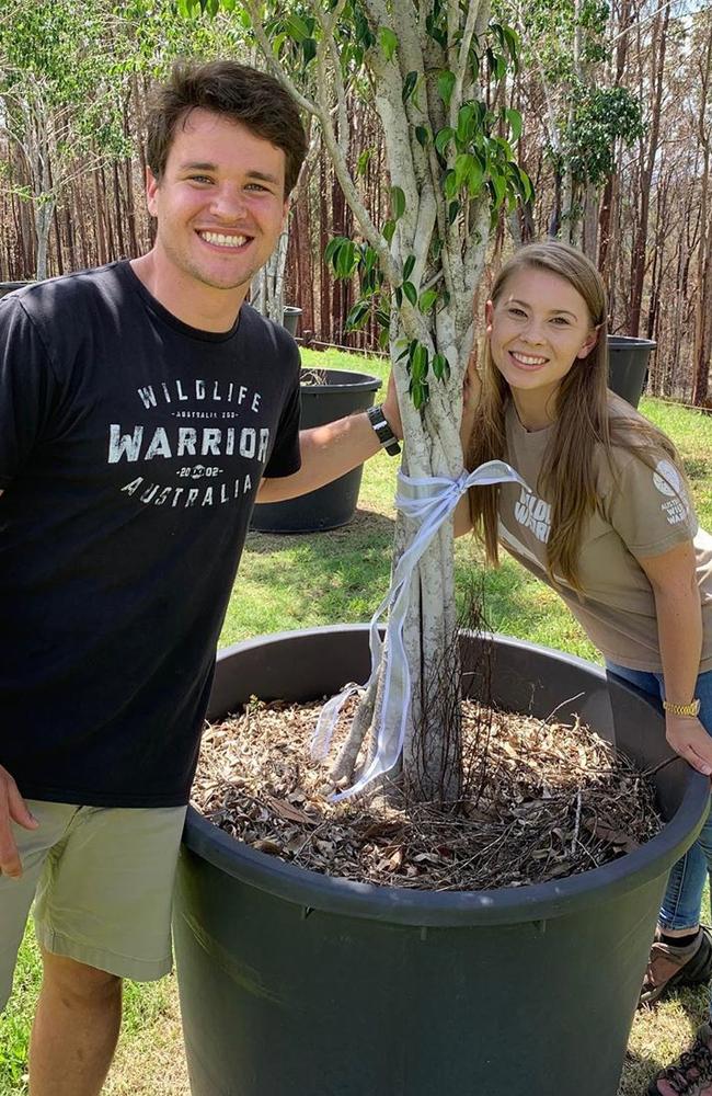 Bindi Irwin and Chandler Powell pose with a tree gifted to them by Russell Crowe for their wedding. Picture: Instagram.