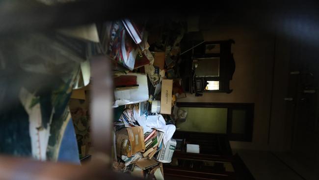 Junk piled up inside has raised fears of a fire. Picture: Peter Wallis