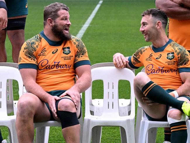 Australia's captain James Slipper (L) shares a light moment with Nic White during the captain's run in Melbourne on July 12, 2024, ahead of the second rugby union Test match against Wales on July 13. (Photo by William WEST / AFP) / --IMAGE RESTRICTED TO EDITORIAL USE - STRICTLY NO COMMERCIAL USE--