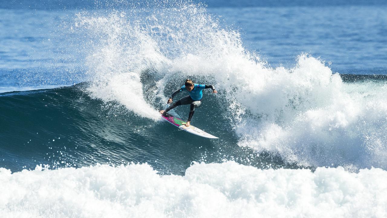 Sally Fitzgibbons in action yesterday after reports of the shark attacks emerged.