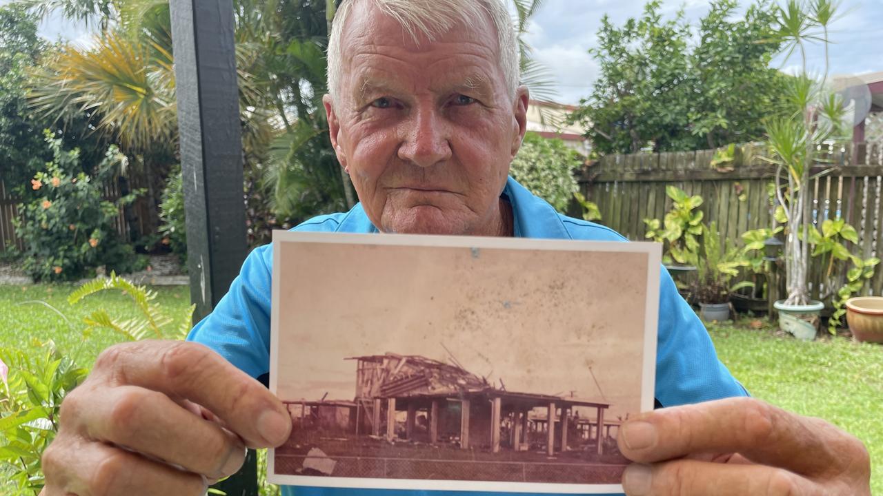 Peter Haigh with a picture he took after Cyclone Tracy of a destroyed house near Casuarina Shopping Centre.