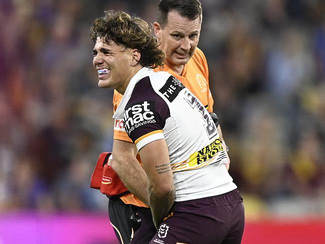 TOWNSVILLE, AUSTRALIA – AUGUST 10: Reece Walsh of the Broncos receives treatment after being injured during the round 23 NRL match between North Queensland Cowboys and Brisbane Broncos at Qld Country Bank Stadium, on August 10, 2024, in Townsville, Australia. (Photo by Ian Hitchcock/Getty Images)