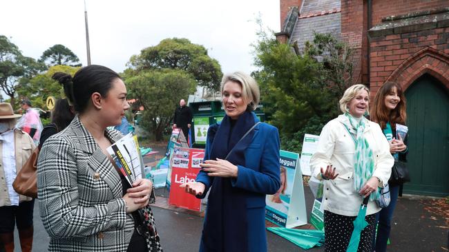 A photo of Katherine Deves talking to voters on election day.