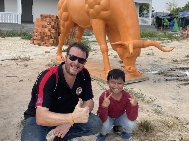 Andrew Costello reigned in the Christmas spirit volunteering in Cambodia. Picture: Facebook