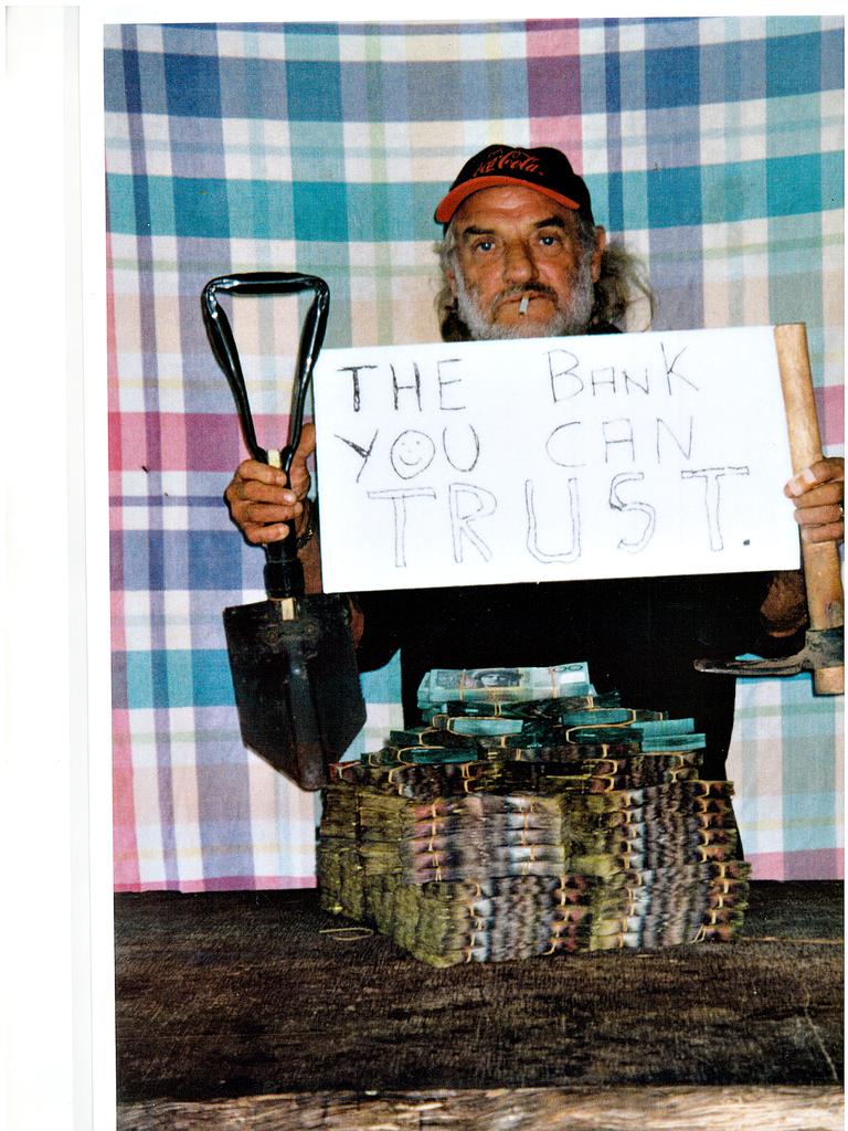 James O'Brien standing behind $3 million in ill-gotten gains dug up from a dam on Falzon's property. O'Brien kept the photo in his truck.