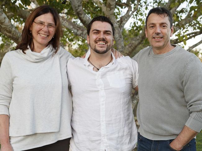 Michael Serretta, with his mum Anne and dad Dave, said Connect Global has helped him build a new life for himself. Picture: David Swift