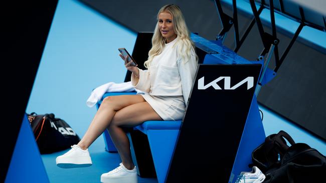 A young lady, believed to be Instgrammer @keelyhannahh, watches courtside as Bernard Tomic practises at Melbourne Park. Picture: Mark Peterson/Tennis Australia