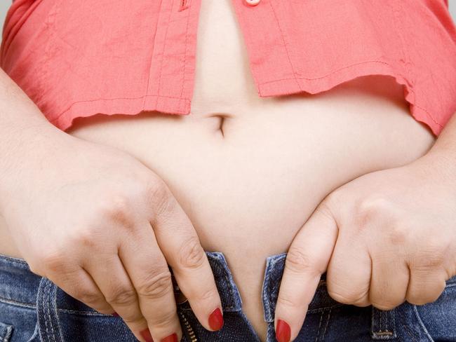 fat, fat girl, obesity, overweight, Squeeze Into Jeans, chubby, bloated, thinkstock generic image of someone too fat for their jeans