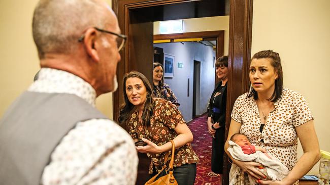 MLC Michael Gaffney talks with sisters and lead petitioners, Jacqui and Natalie Gray and Natalie's 4 day old daughter Tilly as the Voluntary Assisted Dying Bill was passed by the Legislative Council. Picture: Zak Simmonds