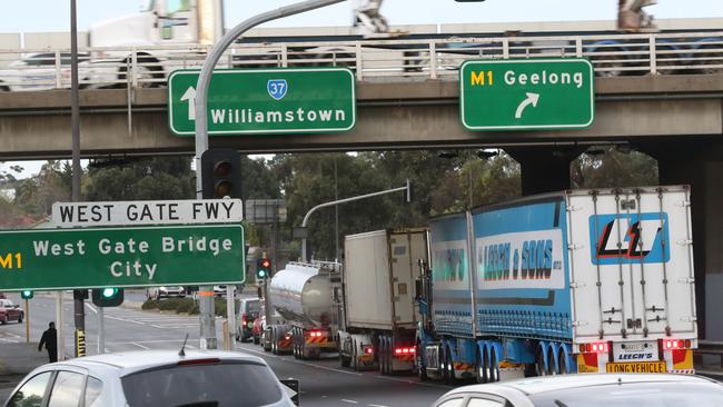 Trucks line up to get onto the Westgate freeway on Williamstown rd in Yarraville Picture: David Crosling