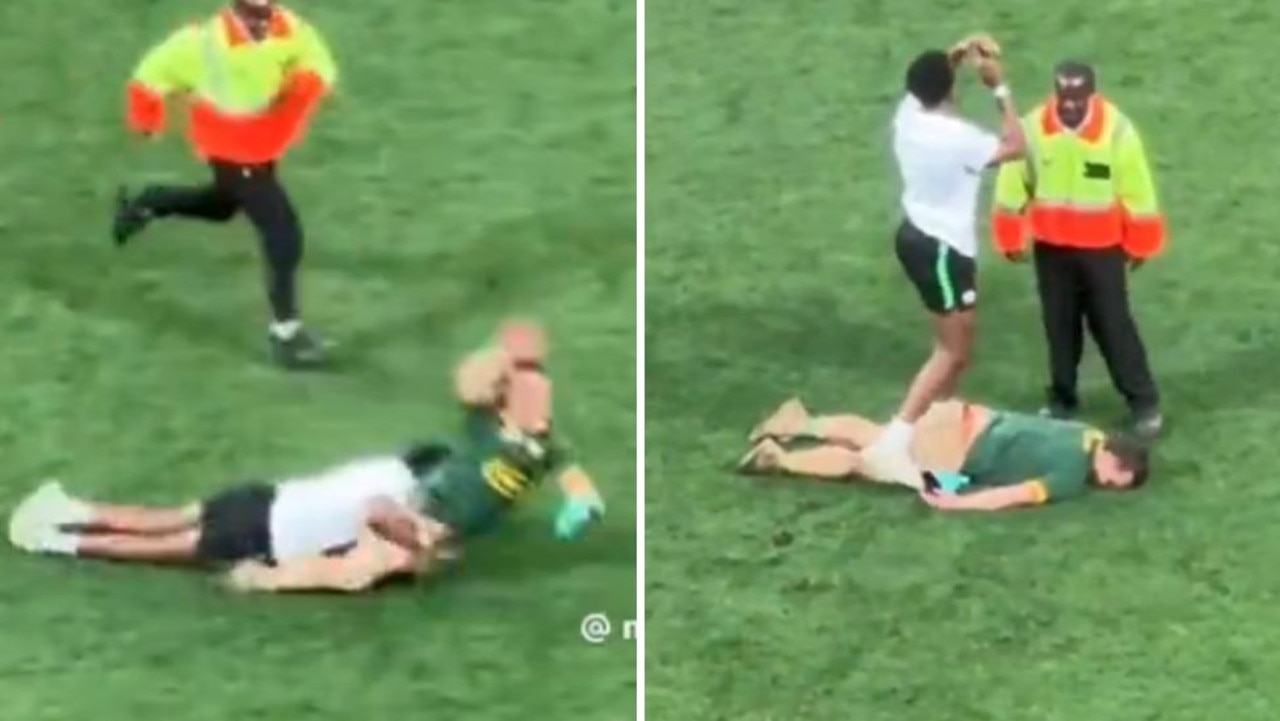 Pitch invader knocked out cold in brutal hit