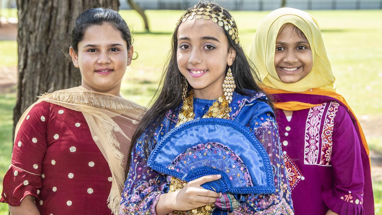 (from left) Saanvi Chauhan, Aseel Anar and Ayesha Muktadir. Harmony Day at Darling Heights State School assembly.