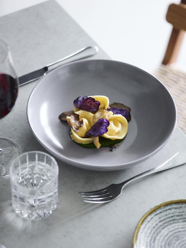 Tortellini parcels of Milawa goat’s cheese with sapphire potato crisps. Picture: Mark Roper