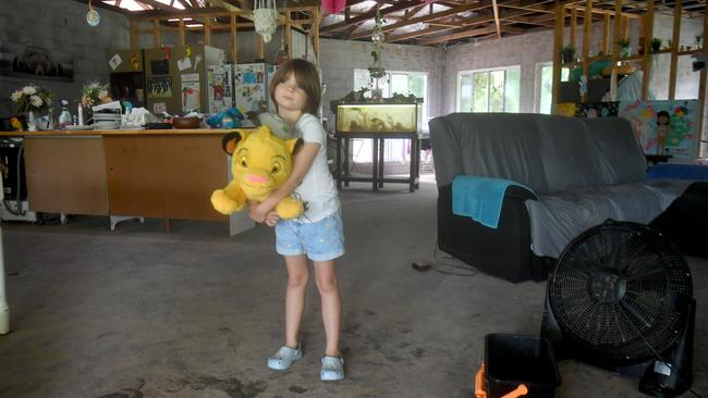 Tuesday February 4. Heavy rain causes flooding in North Queensland. Dezire Lucker 5, at her dad's home affected by floodwater from Bluewater Creek. Picture: Evan Morgan