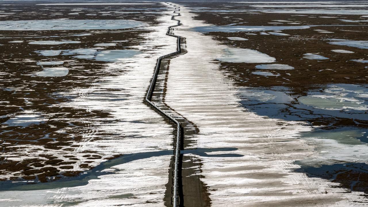 An oil pipeline stretches across the landscape outside Prudhoe Bay in North Slope Borough, Alaska. Santos will push ahead with its Pikka development in the region. Picture: Getty Images