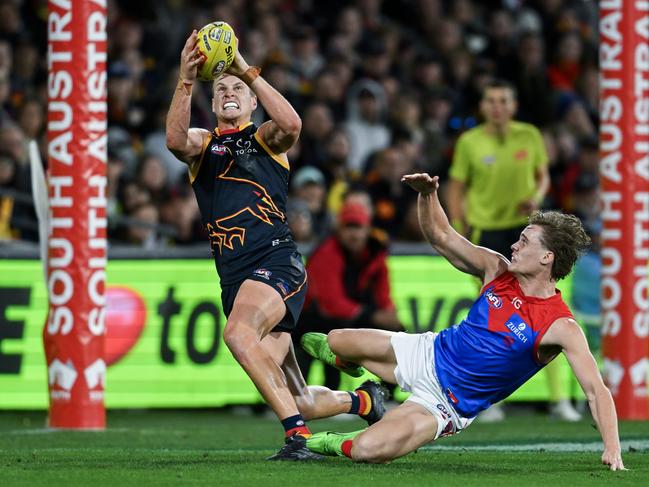 Crows skipper Jordan Dawson takes a strong mark on Demon Trent Rivers. Picture: Mark Brake/Getty Images