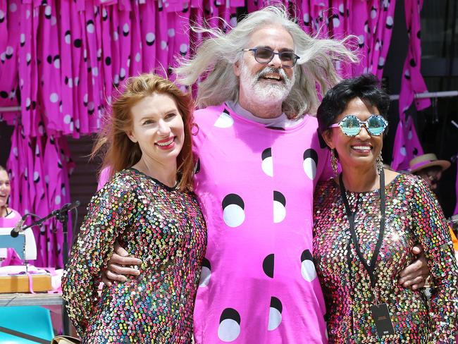 Mona owner David Walsh, centre, with wife Kirsha Kaechele, left, and Varuni Kulasekera in their onesies during the Mofo Block Party at Inveresk. PICTURE CHRIS KIDD