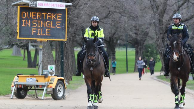 Police patrol the tan track during Covid lockdowns in 2020. Picture: David Crosling