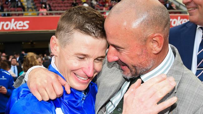 James McDonald (left) is congratulated by Glen Boss after riding Anamoe to win the 2022 Cox Plate at Moonee Valley. Picture: Vince Caligiuri / Getty Images