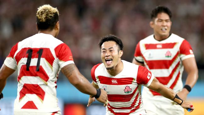 FUKUROI, JAPAN - SEPTEMBER 28: Yu Tamura of Japan (R) celebrates with Lomano Lava Lemeki of Japan following victory in the Rugby World Cup 2019 Group A game between Japan and Ireland at Shizuoka Stadium Ecopa on September 28, 2019 in Fukuroi, Shizuoka, Japan. (Photo by Cameron Spencer/Getty Images)