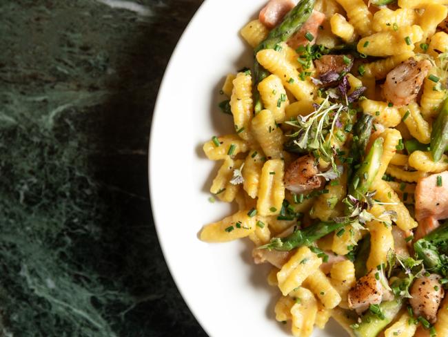 Belvedere restaurant’s housemade saffron cavatelli is served with chunks of salmon and prawns in a creamy sauce that’s also flecked with crisp-tender pieces of asparagus. Picture: Olivia Sattler