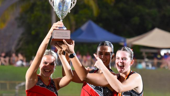 Commerce Pints' Joline Bouwer, Zita Varatharajan and Macenzee Dixon proudly lift the TPL Women's Premiership Trophy. Picture: Darcy Jennings.