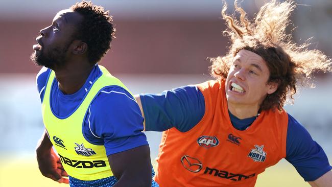 Majak Daw takes on Ben Brown at Kangaroos training this week.