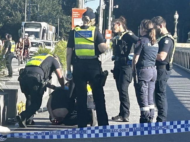 09/02/2024 Police arrest a man on Princes Bridge in St Kilda Rd Melbourne on Saturday afternoon