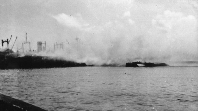 Smoke hangs over the Darwin waterfront after the Japanese attack on Darwin on February, 19, 1942