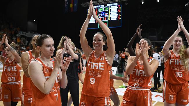 TOWNSVILLE, AUSTRALIA – FEBRUARY 26: The Fire celebrate after winning game two of the WNBL Semi Final series between Townsville Fire and Perth Lynx at Townsville Entertainment Centre, on February 26, 2025, in Townsville, Australia. (Photo by Ian Hitchcock/Getty Images)