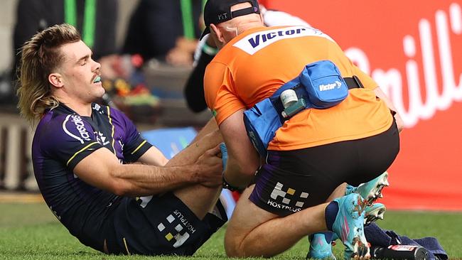 MELBOURNE, AUSTRALIA - MAY 08: Ryan Papenhuyzen of the Storm is checked for a possible injury during the round nine NRL match between the Melbourne Storm and the St George Illawarra Dragons at AAMI Park, on May 08, 2022, in Melbourne, Australia. (Photo by Robert Cianflone/Getty Images)
