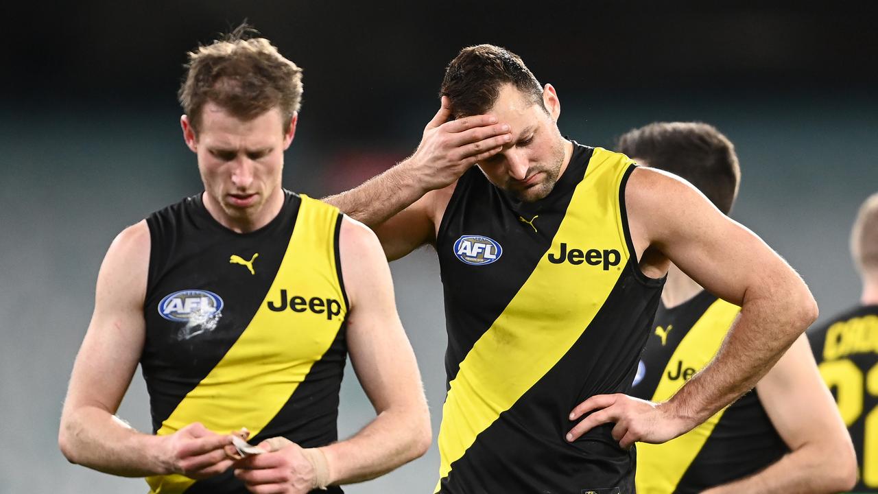 MELBOURNE, AUSTRALIA - JULY 25: Dylan Grimes and Toby Nankervis of the Tigers look dejected after losing the round 19 AFL match between Geelong Cats and Richmond Tigers at Melbourne Cricket Ground on July 25, 2021 in Melbourne, Australia. (Photo by Quinn Rooney/Getty Images)