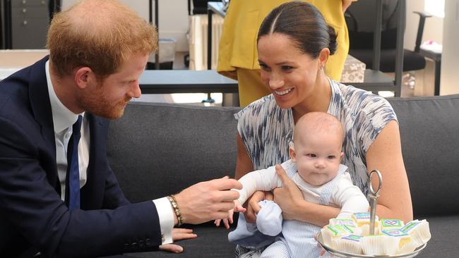 The couple with their baby son Archie as they meet with Archbishop Desmond Tutu in Cape Town this week.