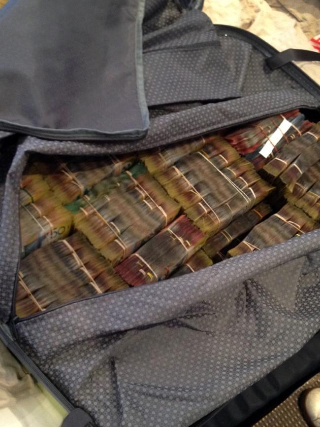 A suitcase containing a sample of the $4 million in cash seized.