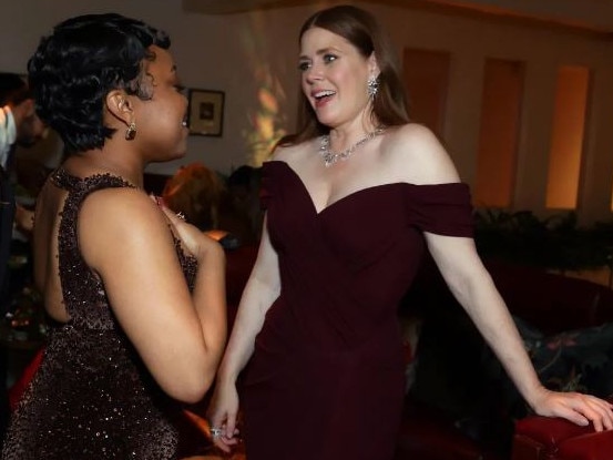 Amy Adams and Abbott Elementary star Quinta Brunson chat at one of the Globes parties. Picture: Getty Images