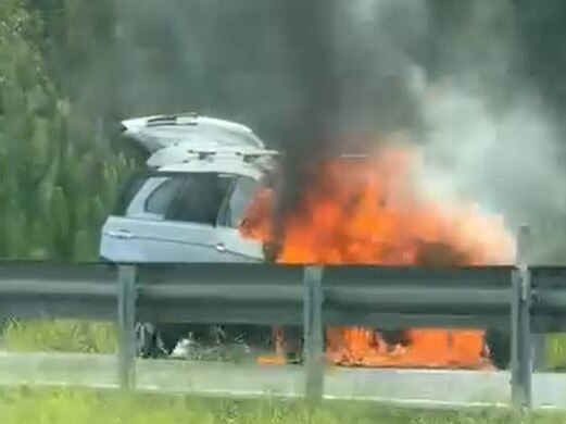 A car engulfed by flames on the Bruce Highway south of the Sunshine Coast. Photo: Facebook