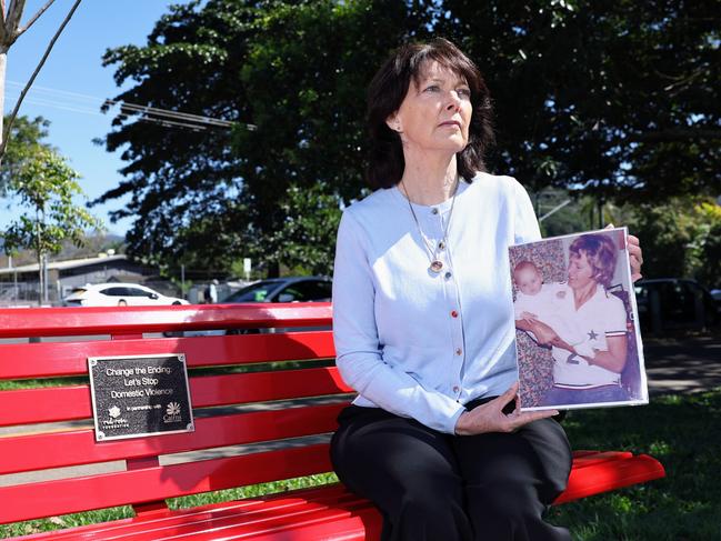 A bright red park bench, which highlights the scourge of domestic violence in society and encourages conversation to end violence, has been installed in a Lake Street park. The site of the bright bench is directly opposite where Cairns woman Gwen Grover was found in a car with a gunshot wound to her head in 1983. Sister of Gwen Grover Sue Cole is humbled to see the new red bench installed on Lake Street in memory of Gwen. Picture: Brendan Radke