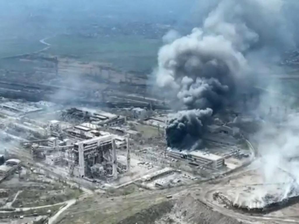 Video grab taken shows smoke billowing above Azovstal steel plant and the destroyed gates of Azov Shipyard, as Russia continues its push to capture the besieged port city of Mariupol. Picture: AFP