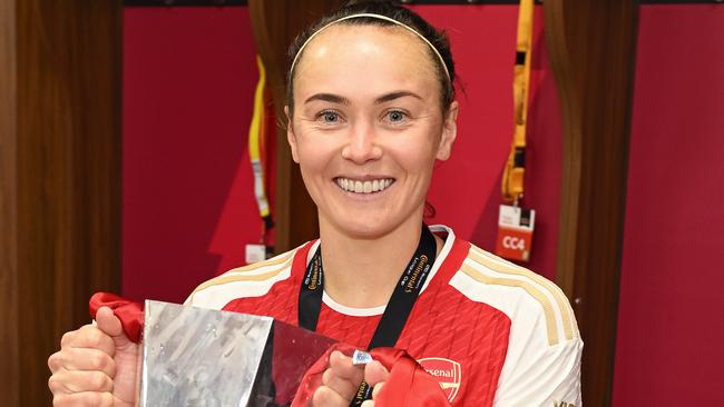 WOLVERHAMPTON, ENGLAND - MARCH 31: Caitlin Foord of Arsenal poses for a photo with the trophy in the dressing room after winning the FA Women's Continental Tyres League Cup Final match between Arsenal and Chelsea at Molineux on March 31, 2024 in Wolverhampton, England. (Photo by Alex Burstow/Arsenal FC via Getty Images)