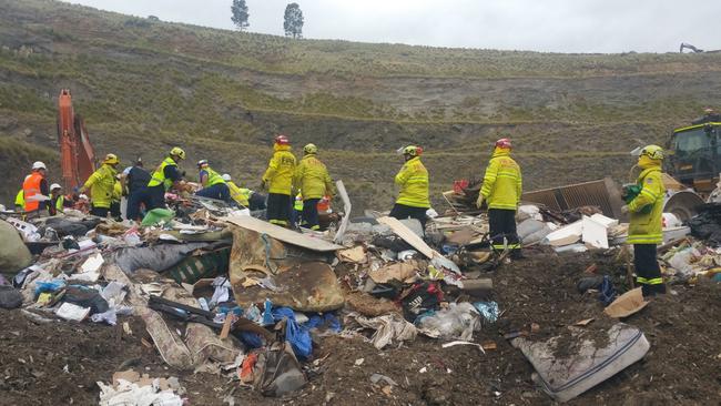 Crews were forced to comb through large amounts of rubbish to get to the men.